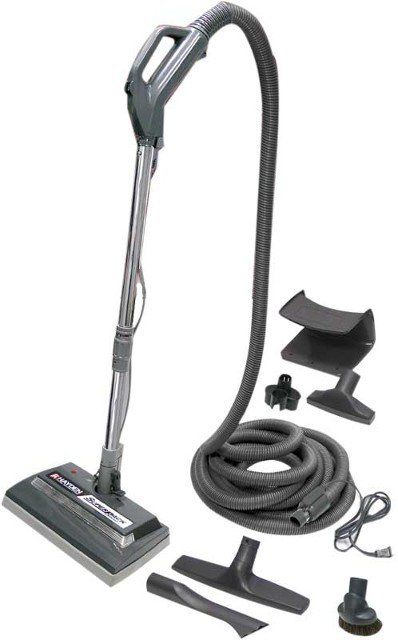 Gray vacuum cleaner with accessories.