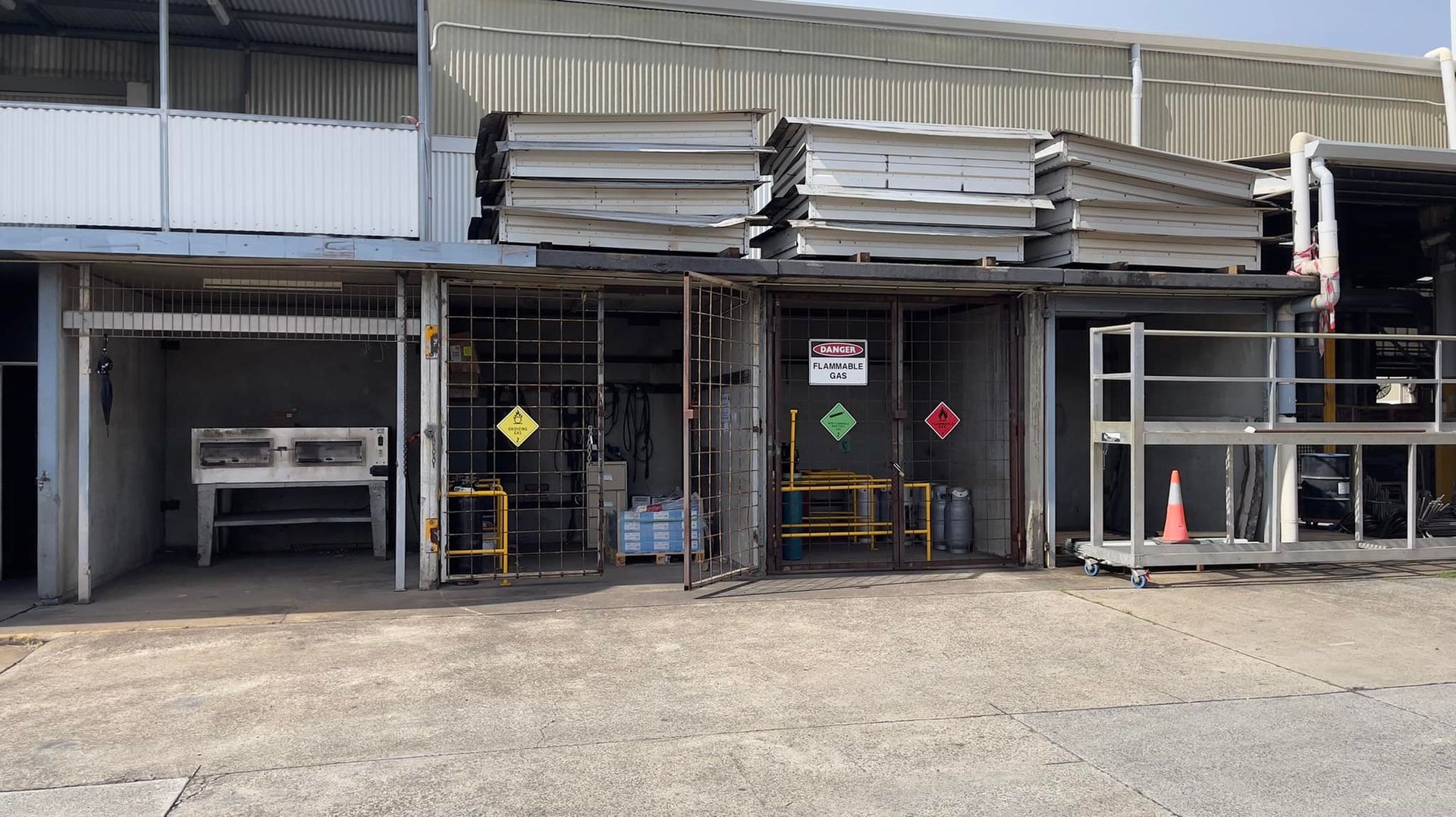 A warehouse with a lot of boxes stacked on top of each other.