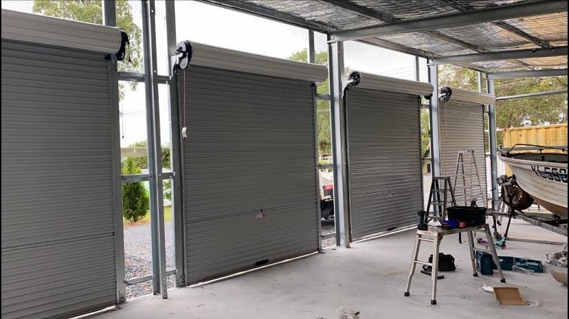 A garage door is being installed in a building.