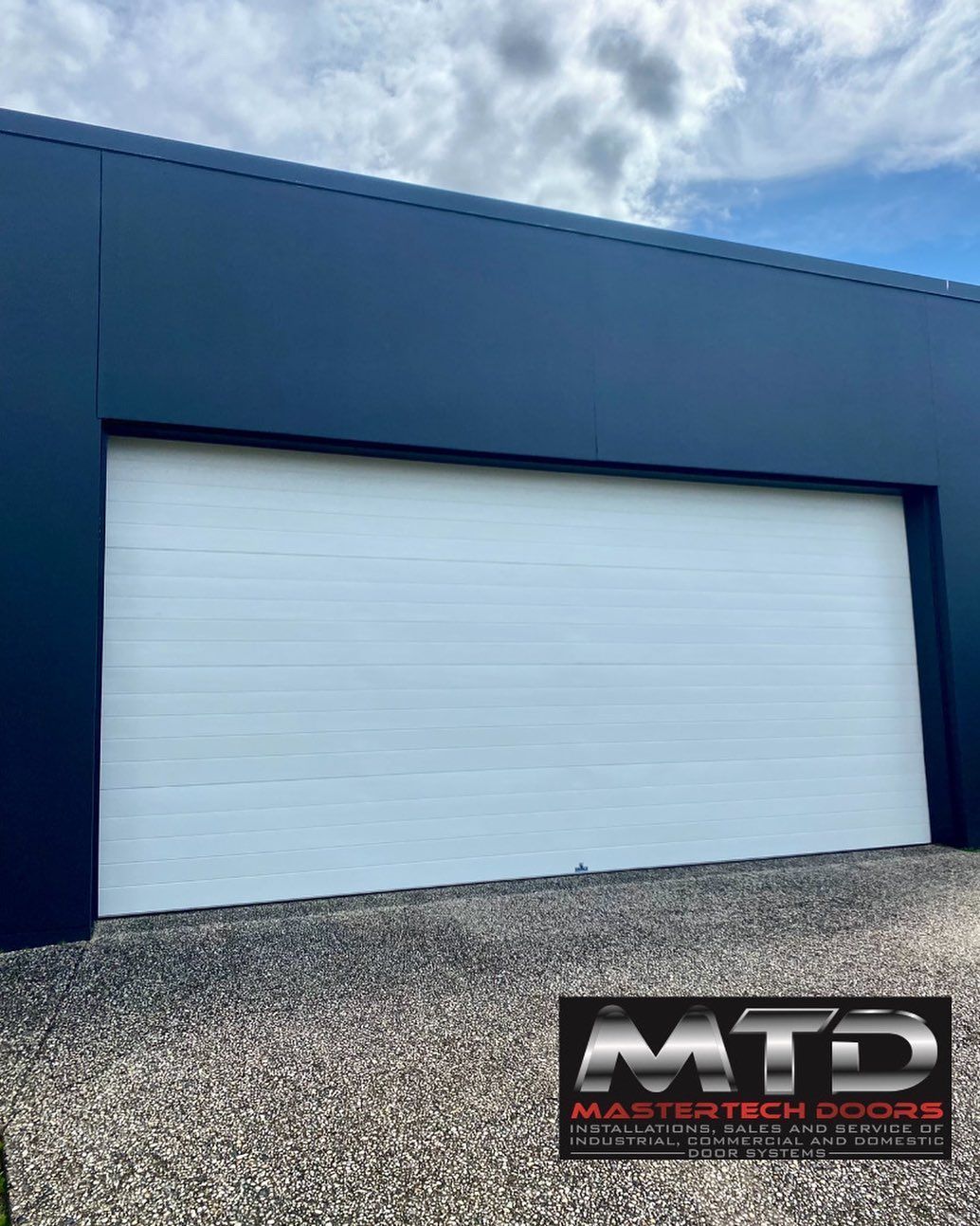 A white garage door with the word mtd on it