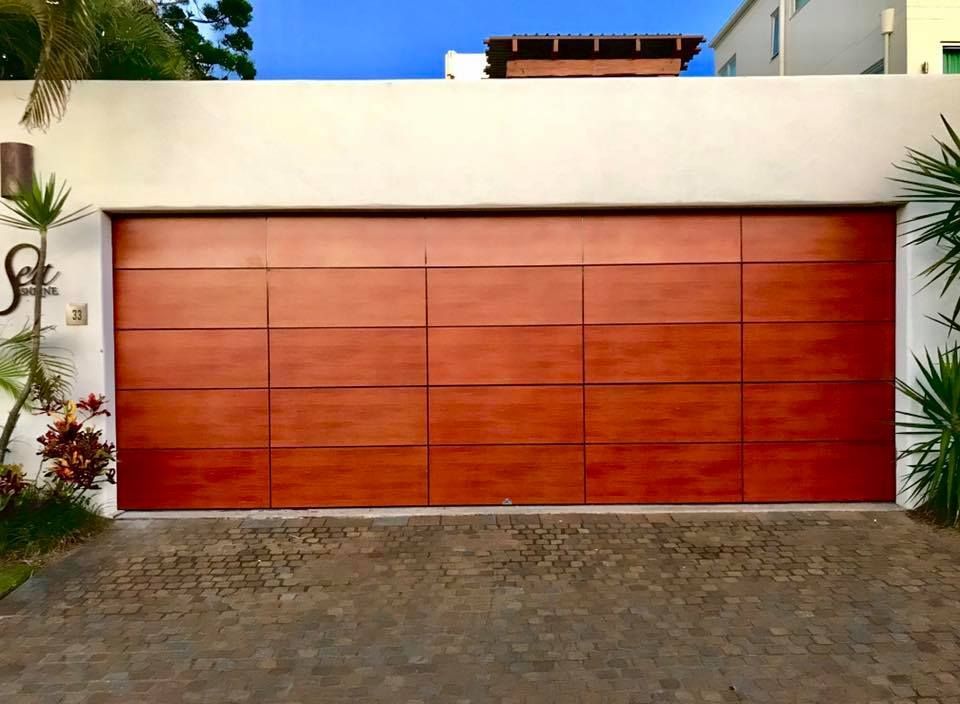 A large wooden garage door with the letter s on it