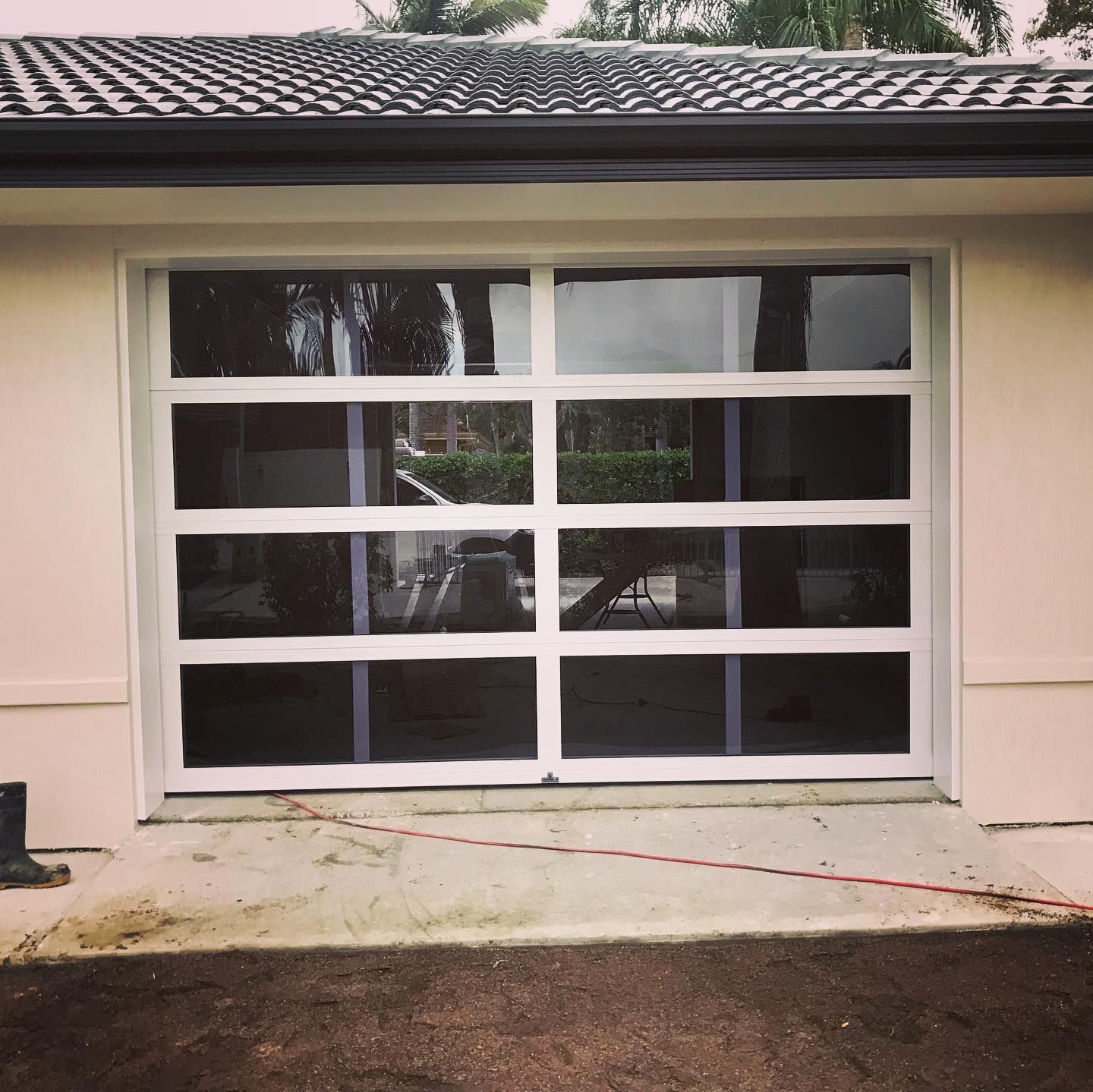 A white garage door with a lot of windows