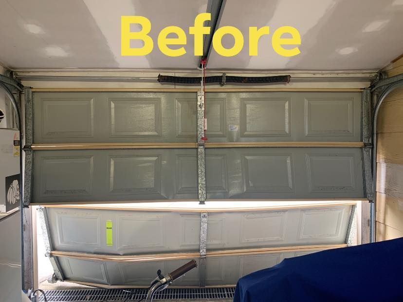 A picture of a garage door before being repaired