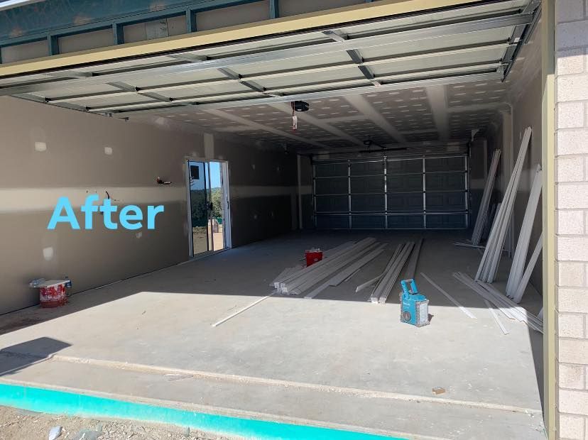 A garage with the door open and the words `` after '' written on it.