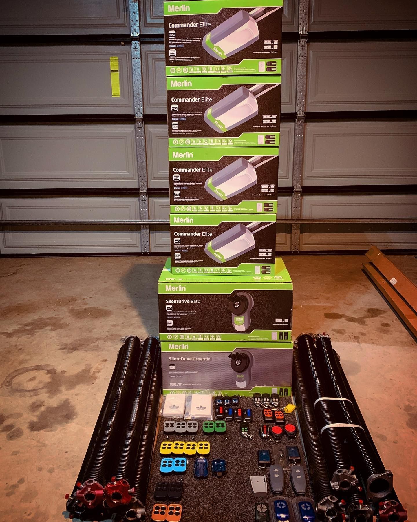 A bunch of boxes of garage door openers are stacked on top of each other