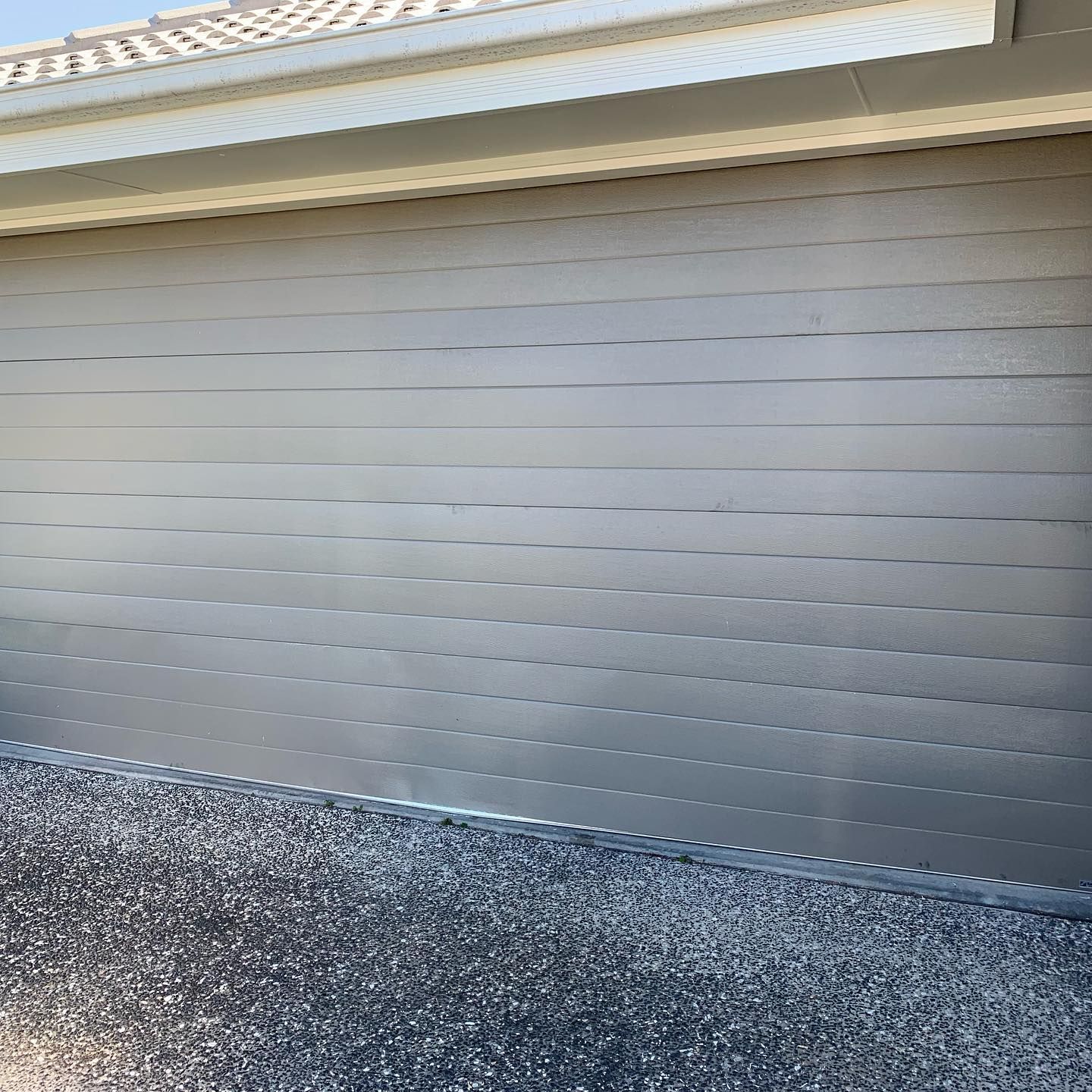 A close up of a garage door on a house.