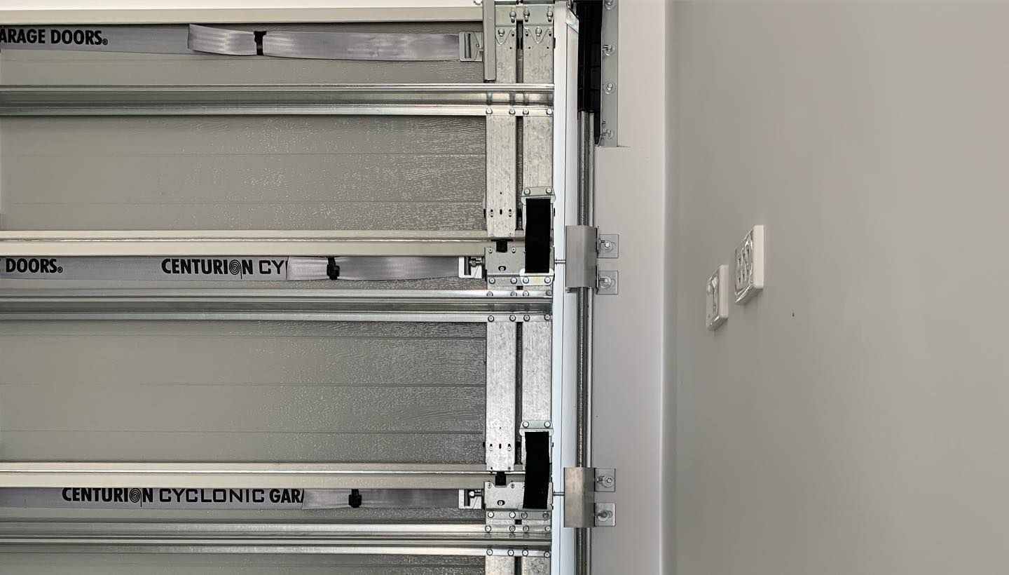 A close up of a garage door with a metal frame.