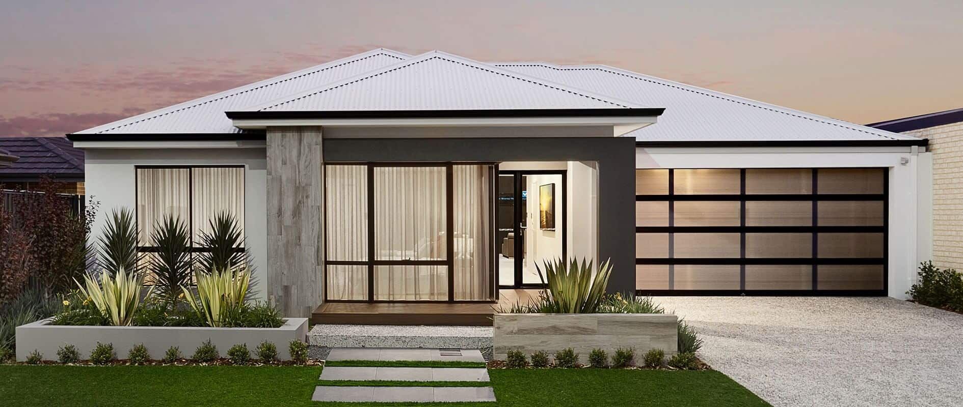 The front of a modern house with a large garage door