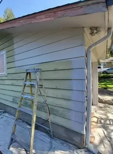 House with chipped and faded paint before exterior painting service