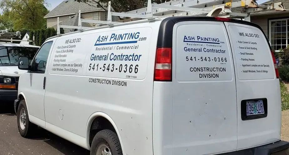 Side view of Ash Painting company van with logo and phone number