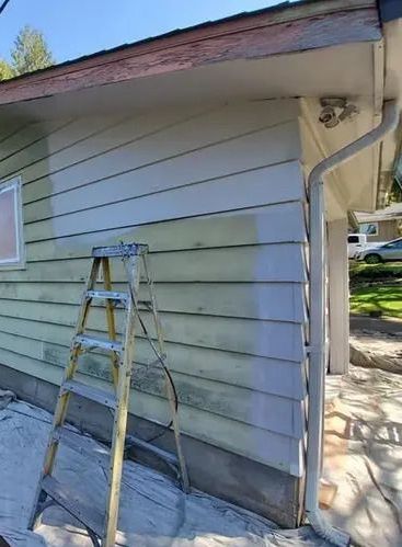 House with chipped and faded paint before exterior painting service