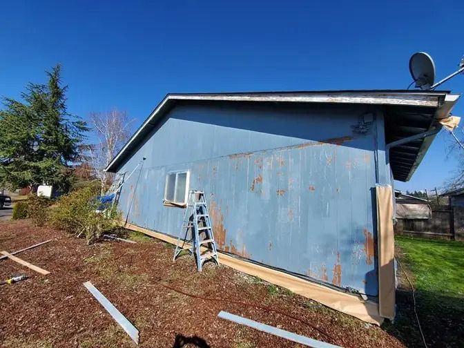 House with peeling paint and weathered siding before Ash Painting service