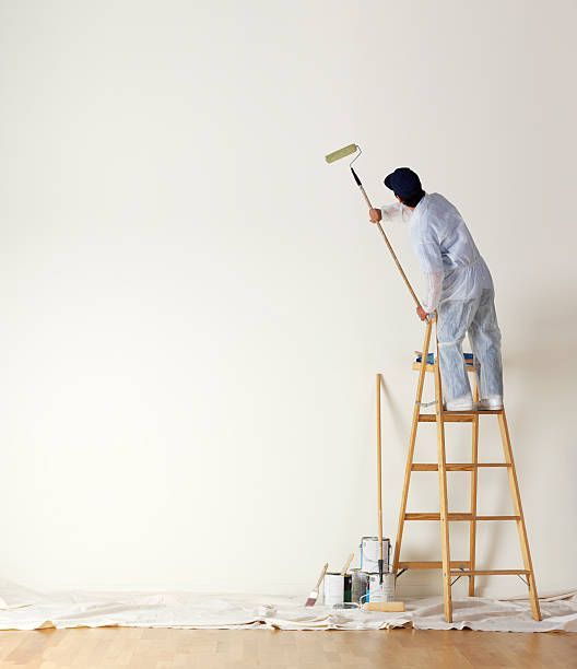 an expert in painting performing professional painting services for a property in Oregon