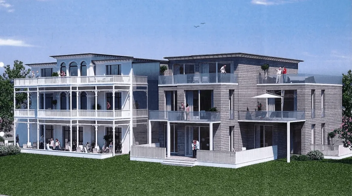 Ein großes Gebäude mit vielen Fenstern und Balkonen