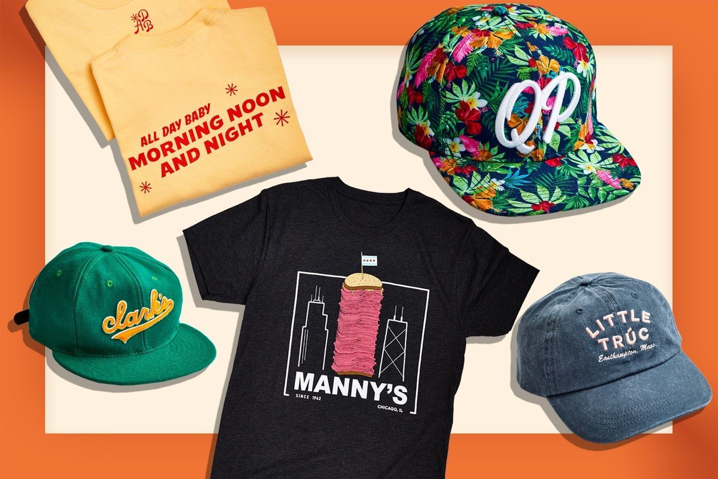 A bunch of hats and shirts are on a table