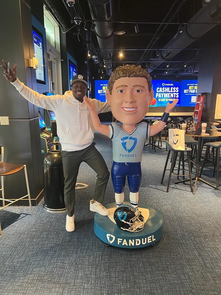 A black and white photo of a person wearing a shirt that says the apra brothers