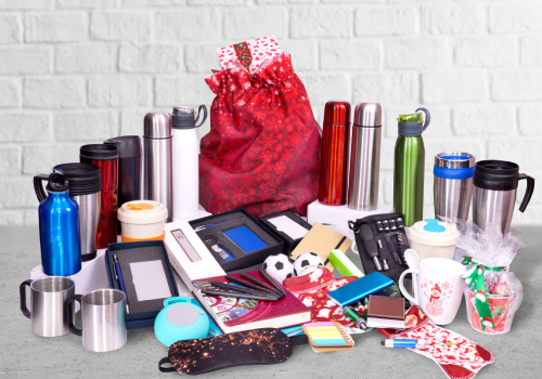 A bunch of bottles and mugs are sitting on a table.