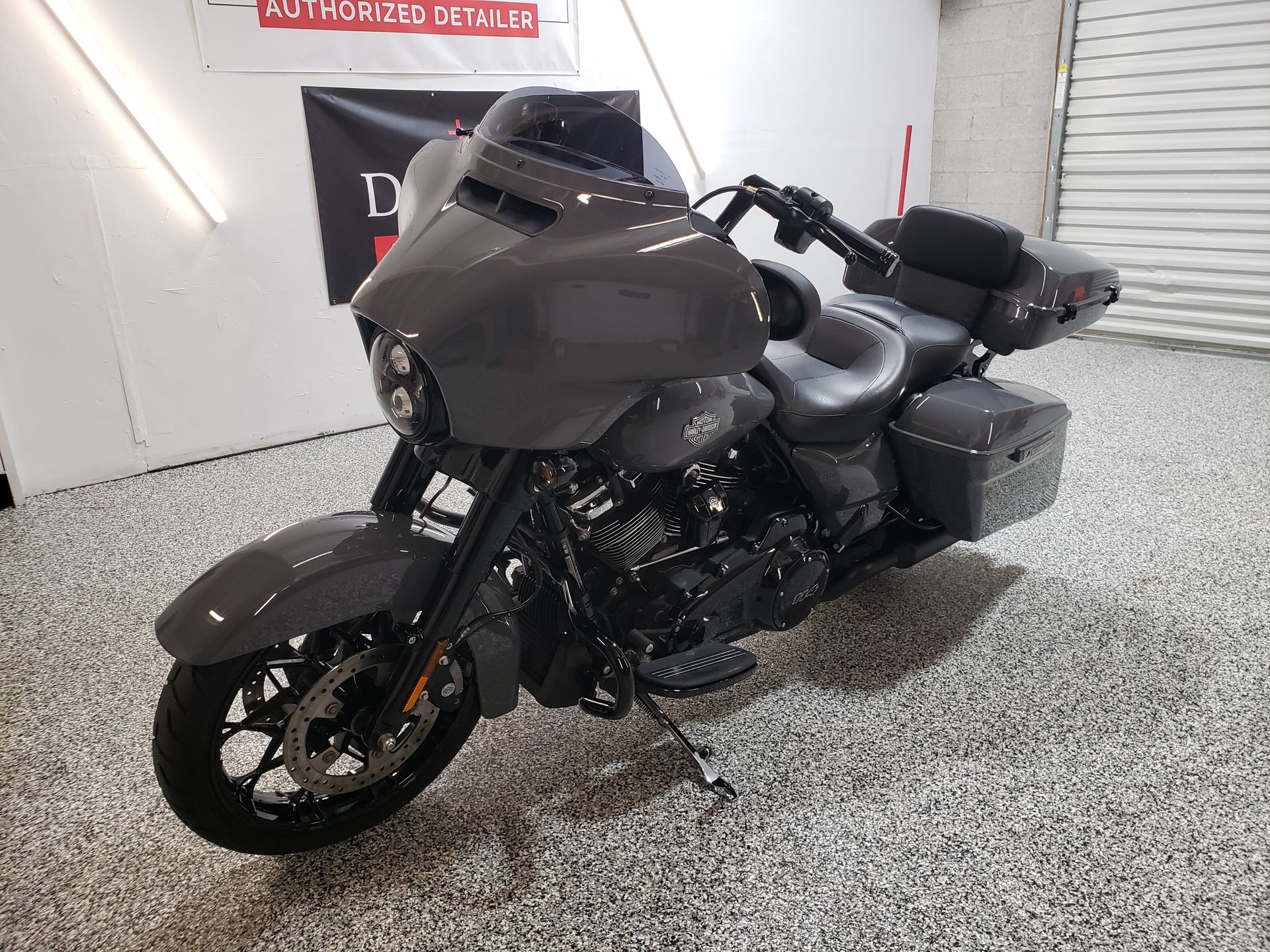 A harley davidson motorcycle is parked in a garage.