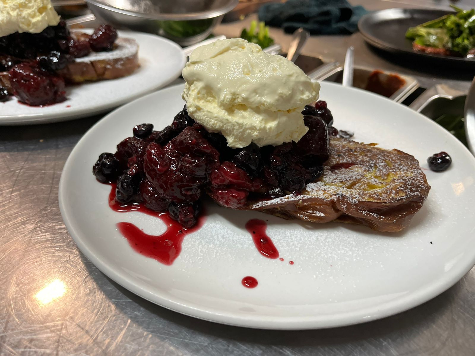 Overhead shot of a meal on a plate with avocado, chili, and salsa.