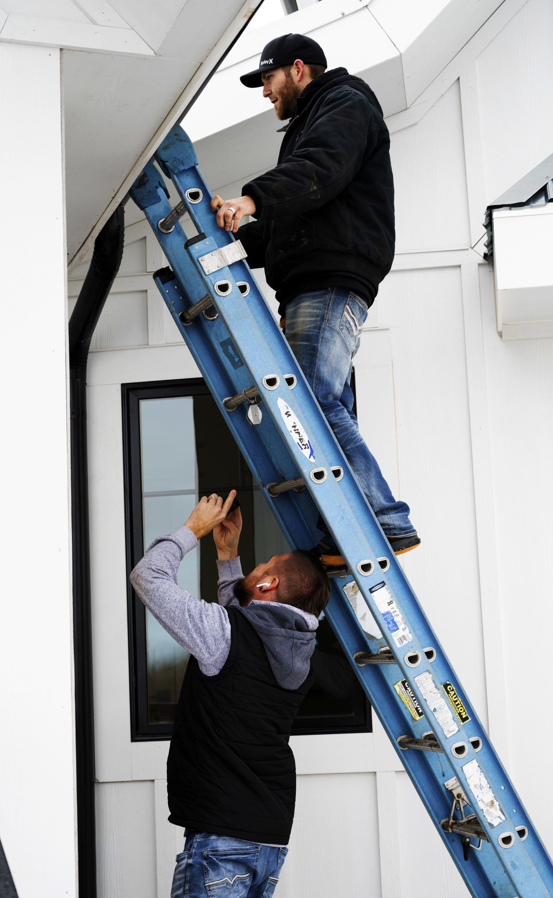 person working on roof