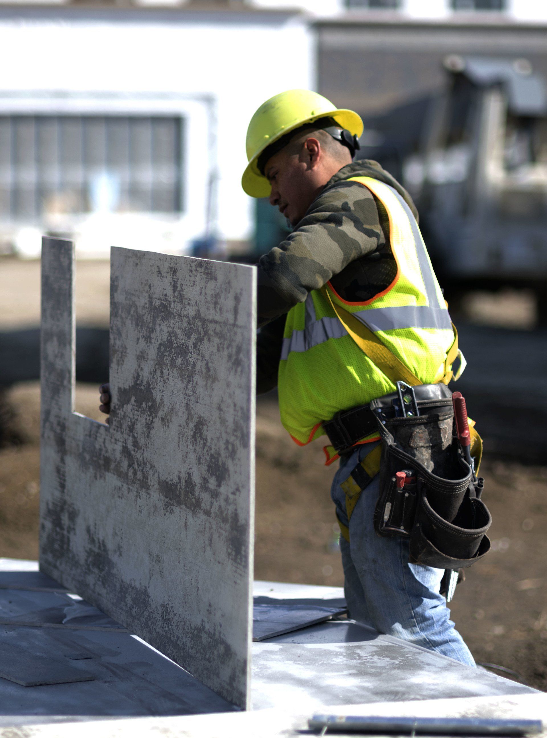 a construction worker wearing a hard hat and safety vest