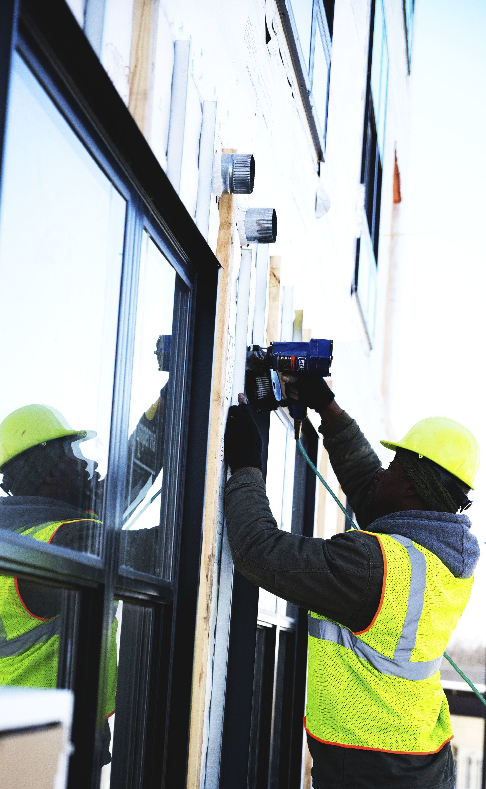 person working on building exterior