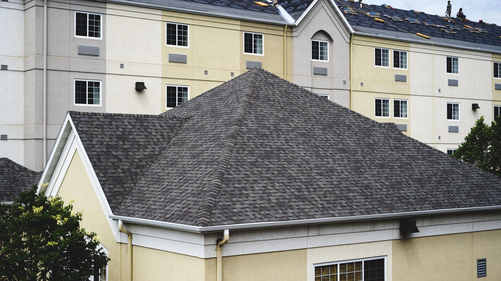 a large building with a roof that has a lot of shingles on it