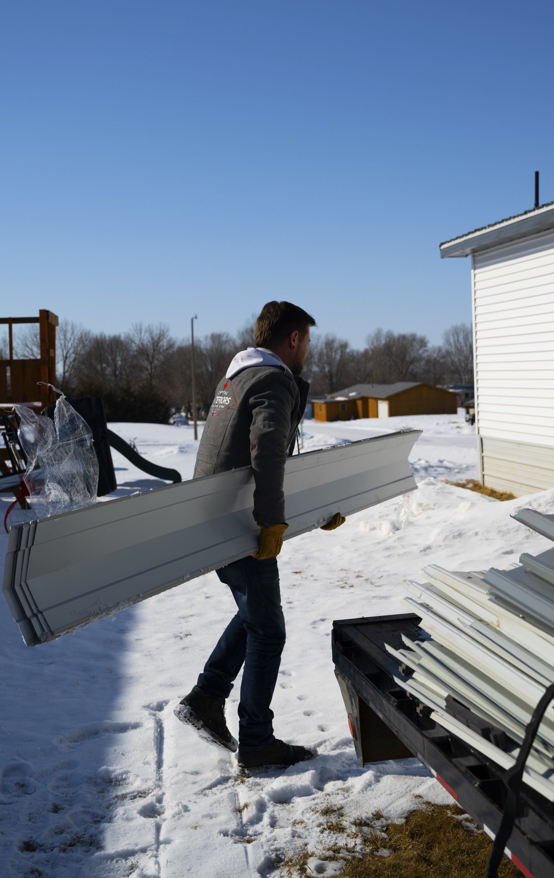 person carrying housing supplies