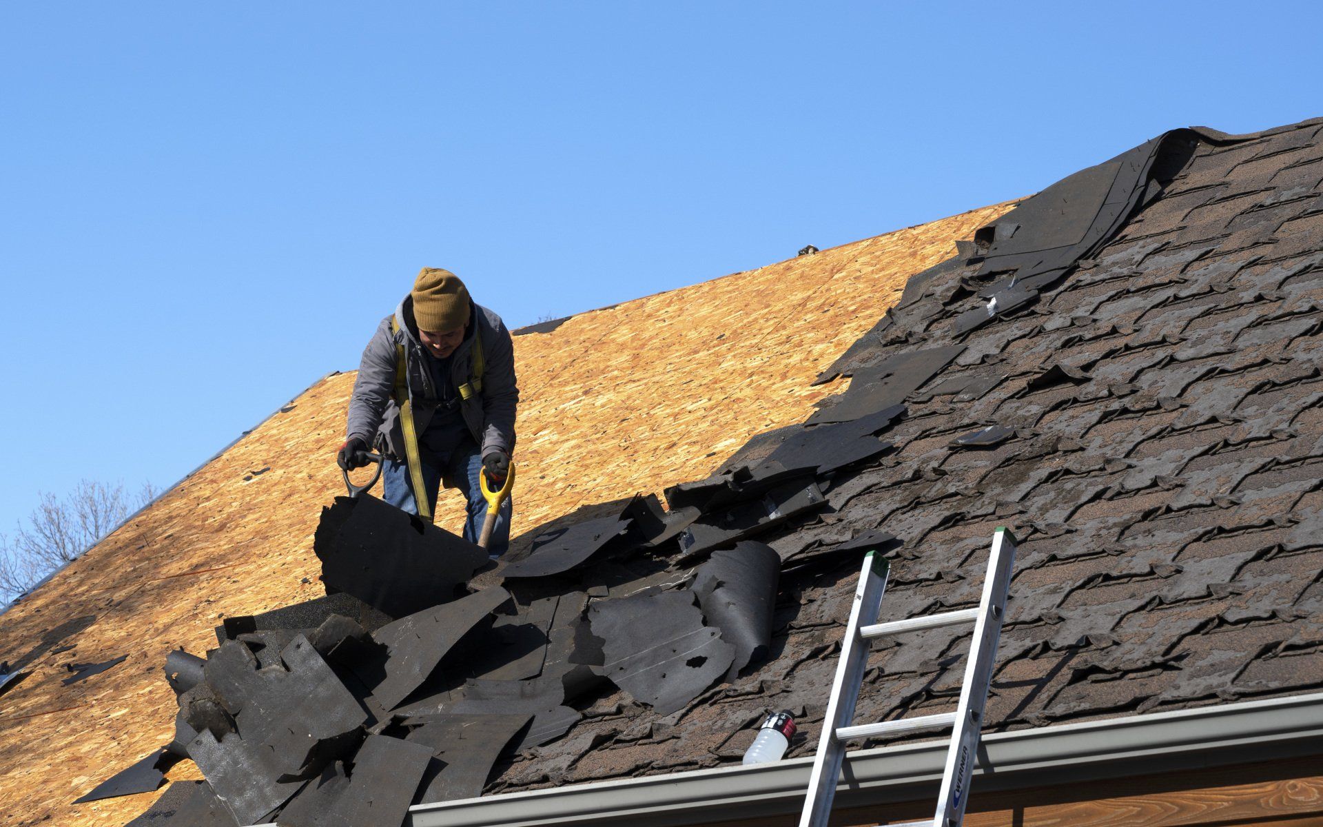 Man performing a roof replacement