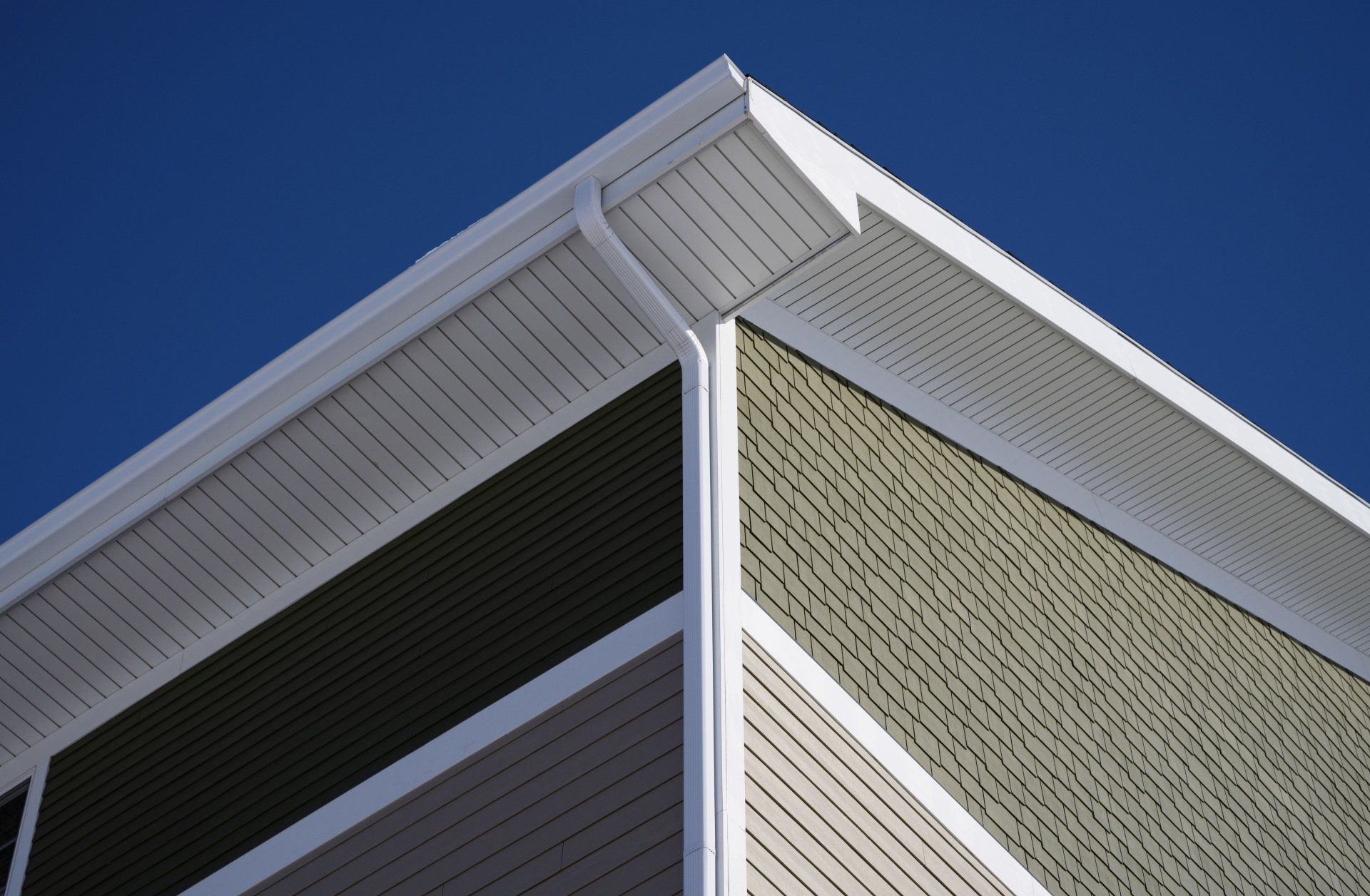 the corner of a building with a blue sky in the background