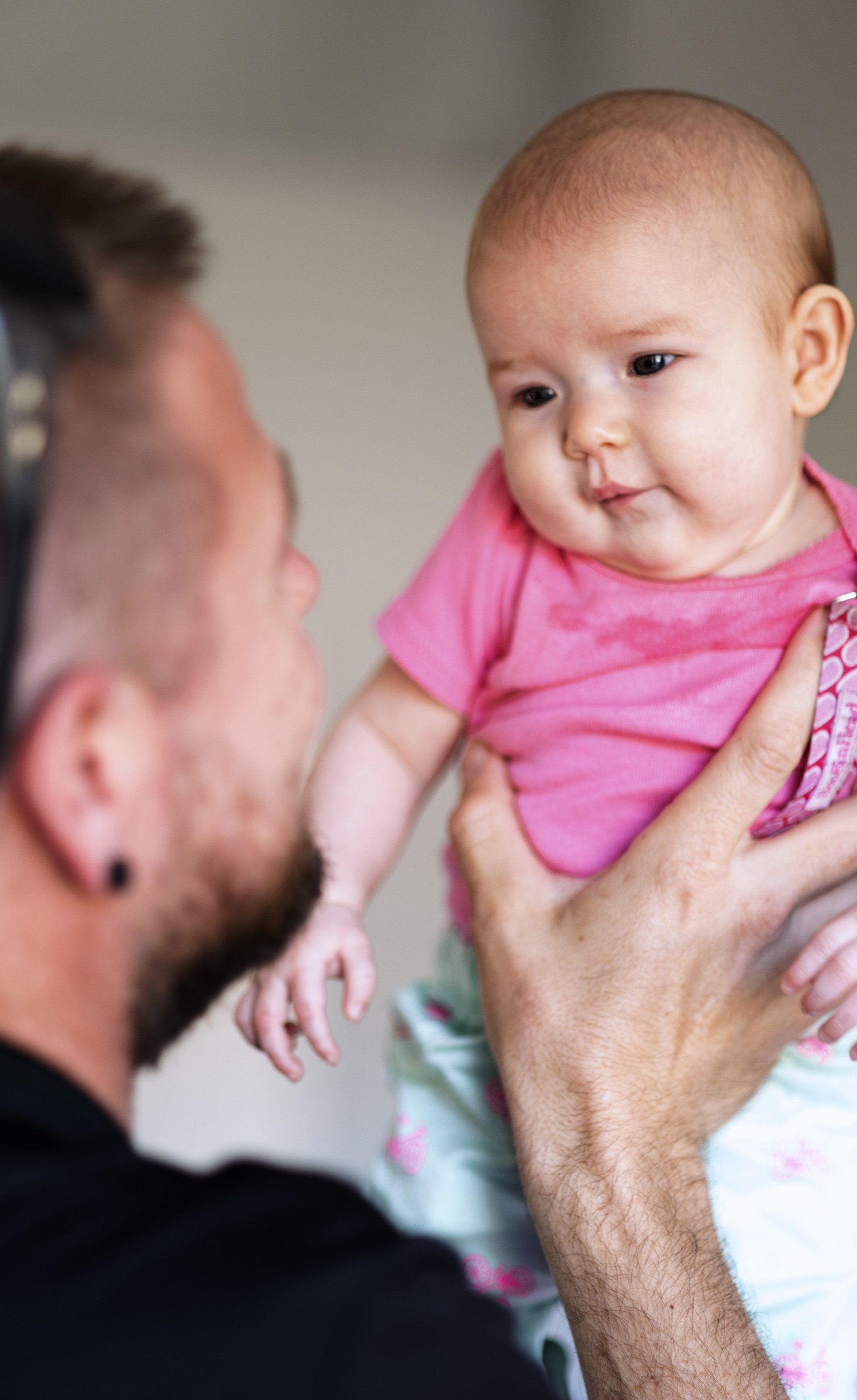 person looking at baby