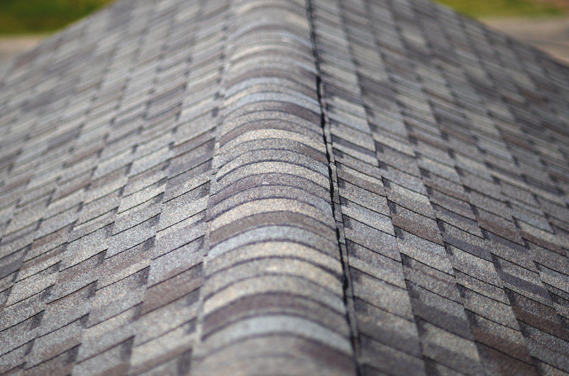 a close up of a roof with shingles on it .