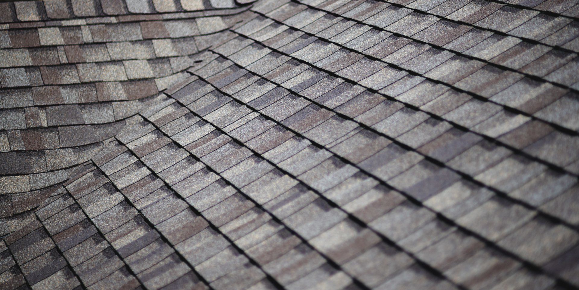 a close up of a roof with shingles on it .