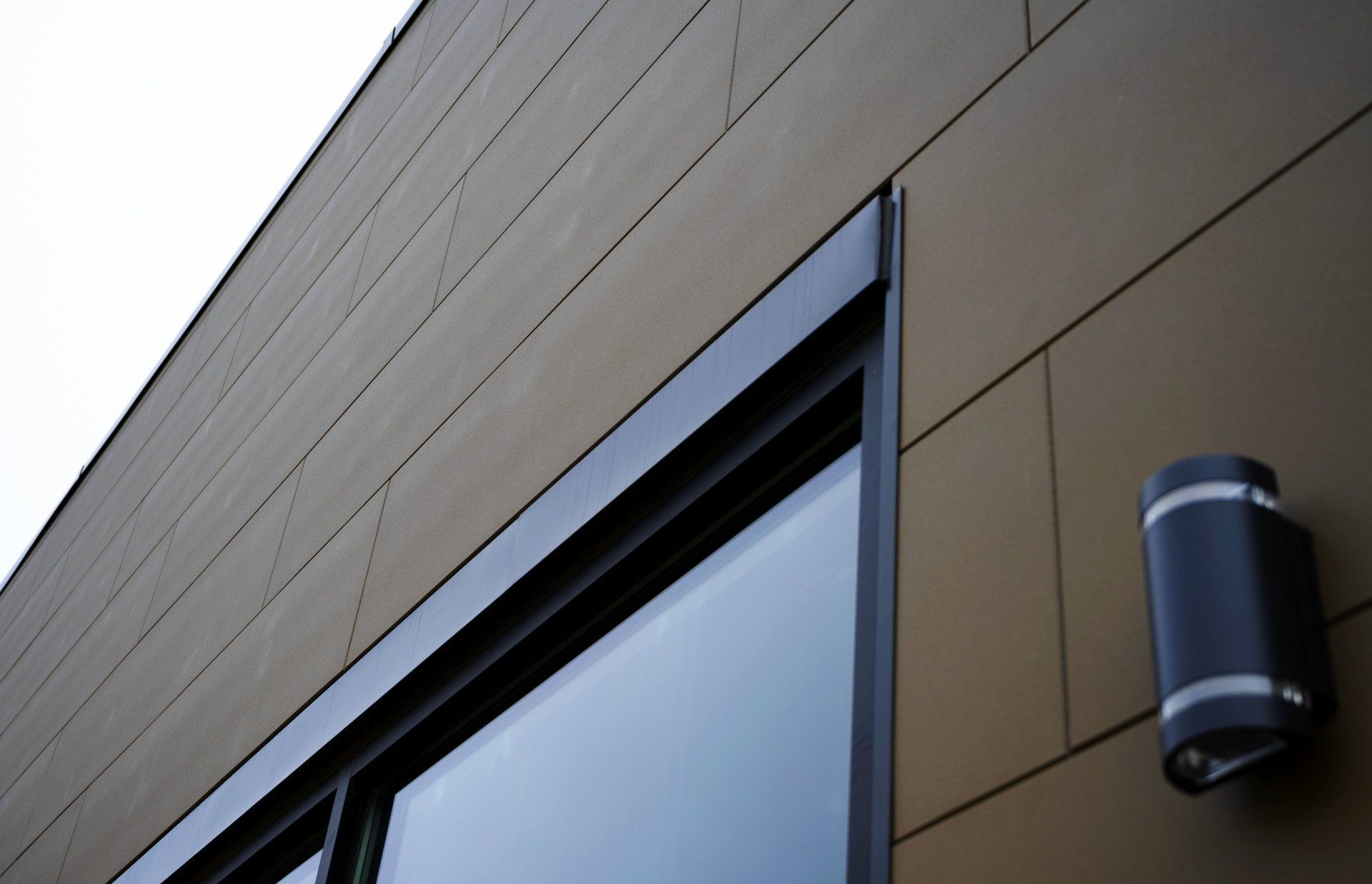 a building with a window and a light on the side