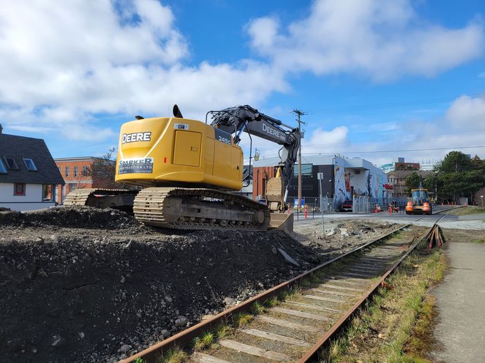 excavator grading the lot