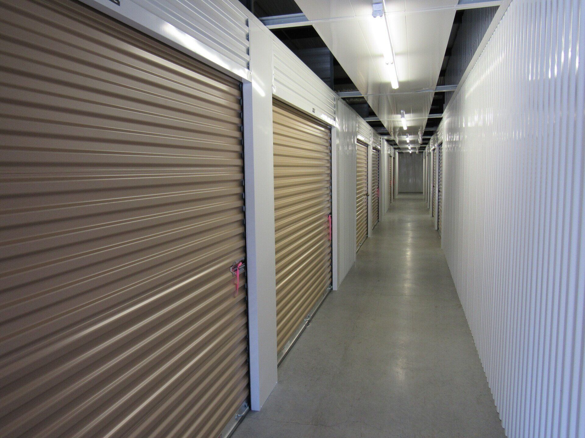 Man Unlocking Storage Unit — Newnan, GA — Greison Storage Mart