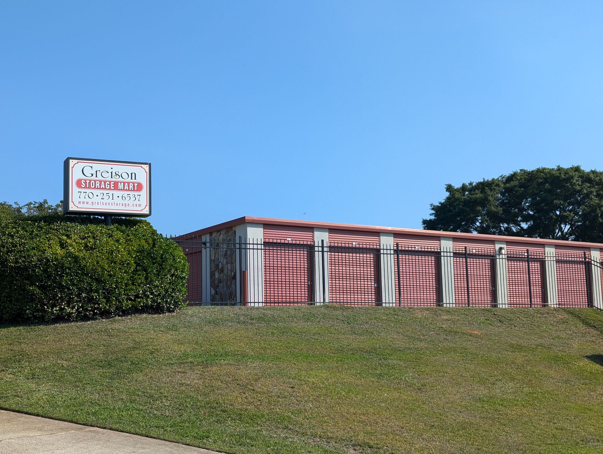 Storage units provided by Greison Storage Mart in Sharpsburg, GA, showcasing a well-organized self-storage warehouse
