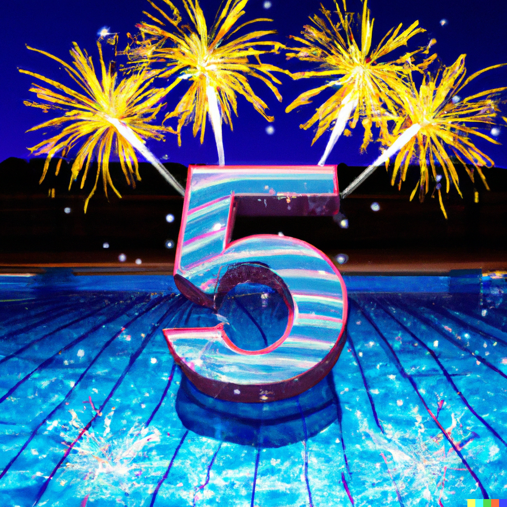 Large number 5 with fireworks over a body of water, celebrating.