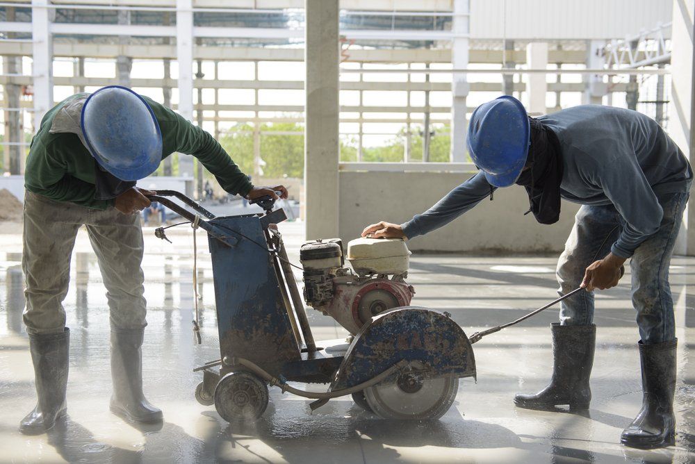 Workers Using Machine Cutting Concrete — Provide Concreting in Caboolture, QLD
