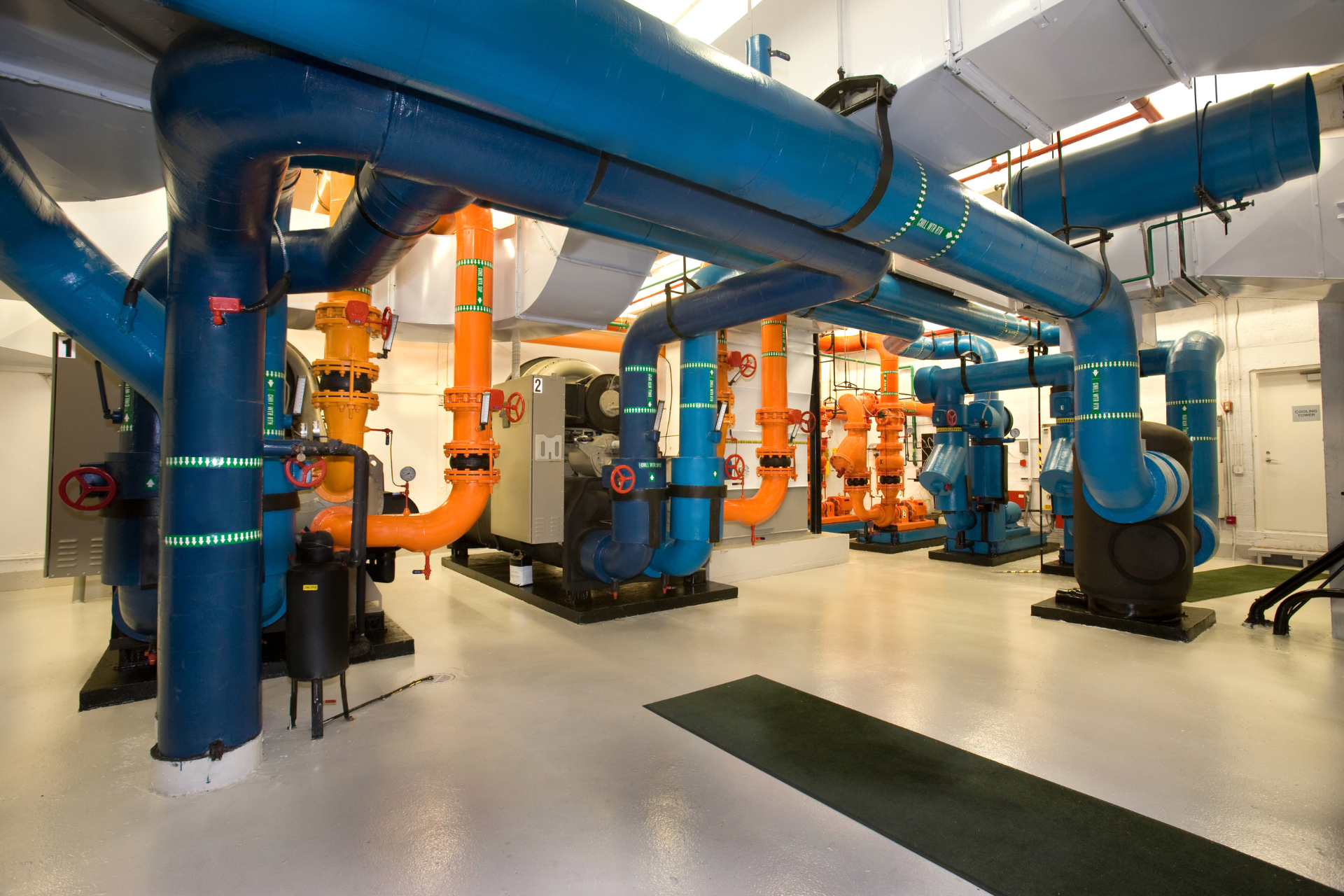 A room filled with lots of pipes and pumps