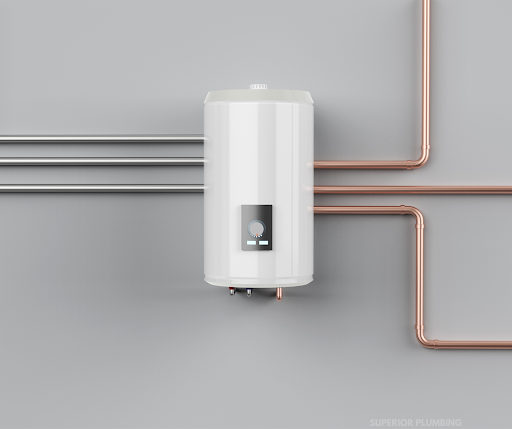 A water heater is connected to copper pipes on a wall.