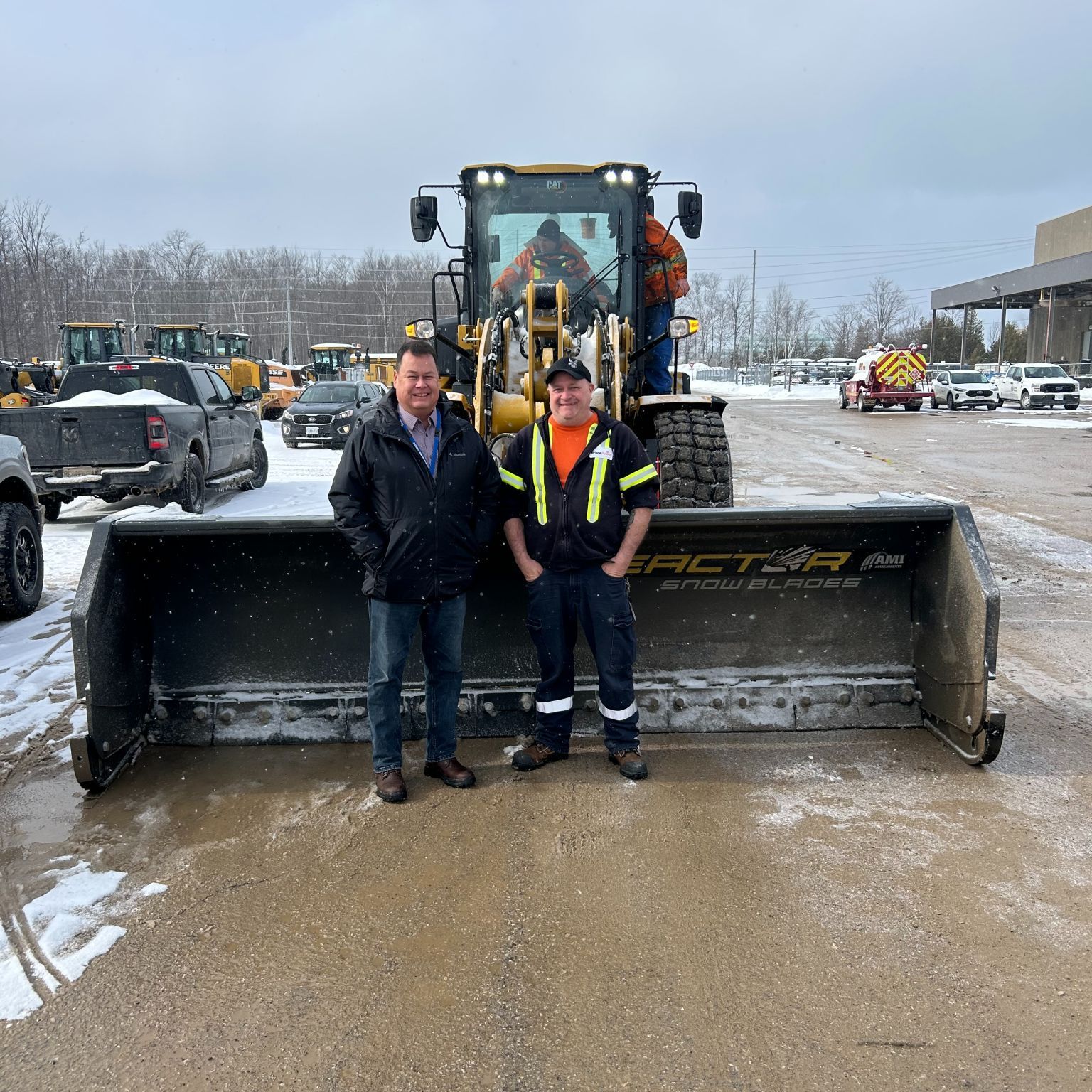 Shane Chegano and worker with equipment