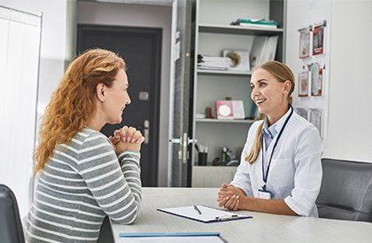 Consulting Red Haired Woman — Key West, FL — Dr. Arthur J. Grizzle, M.D.