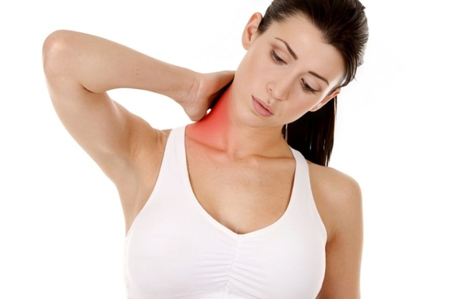 A Woman is Holding Her Neck in Pain — Anderson Family Chiropractic Health Centre in Mount Pleasant, QLD 