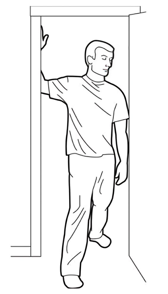 A Man Leaning Against a Wall — Anderson Family Chiropractic Health Centre in Mount Pleasant, QLD