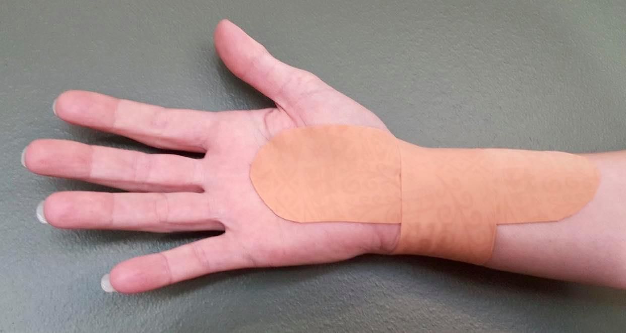 A Close Up of a Person 's Hand With a Bandage on It — Anderson Family Chiropractic Health Centre in Mount Pleasant, QLD