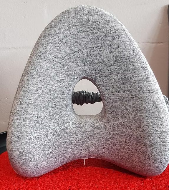 A Grey Pillow With a Hole — Anderson Family Chiropractic Health Centre in Mount Pleasant, QLD