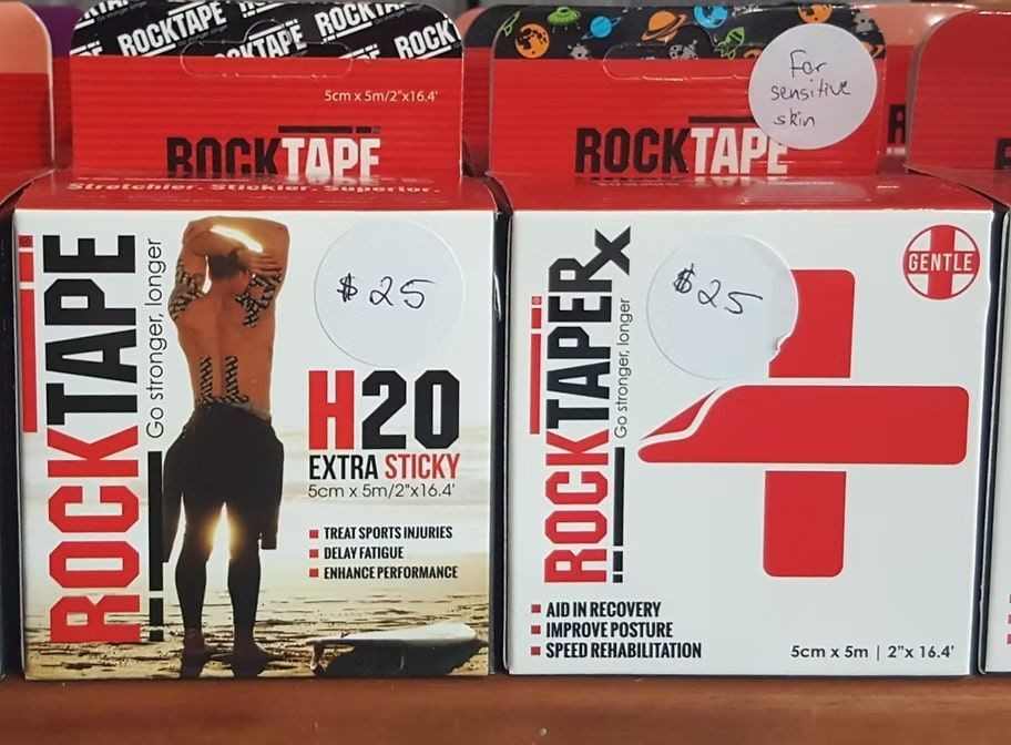 Two Boxes of Rocktape Are Sitting on a Table — Anderson Family Chiropractic Health Centre in Mount Pleasant, QLD