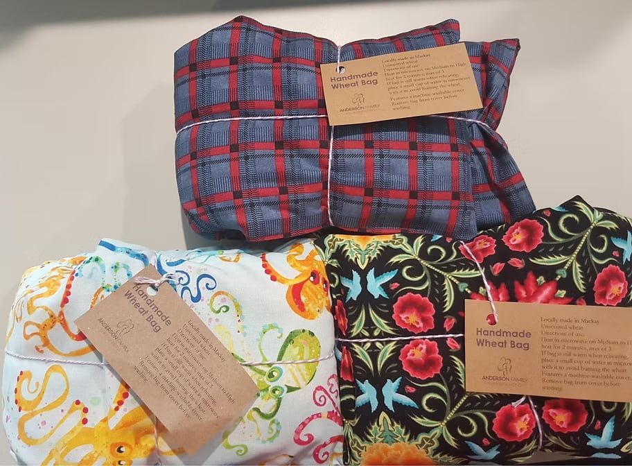 A Bunch of Pillows Are Stacked on Top of Each Other — Anderson Family Chiropractic Health Centre in Mount Pleasant, QLD