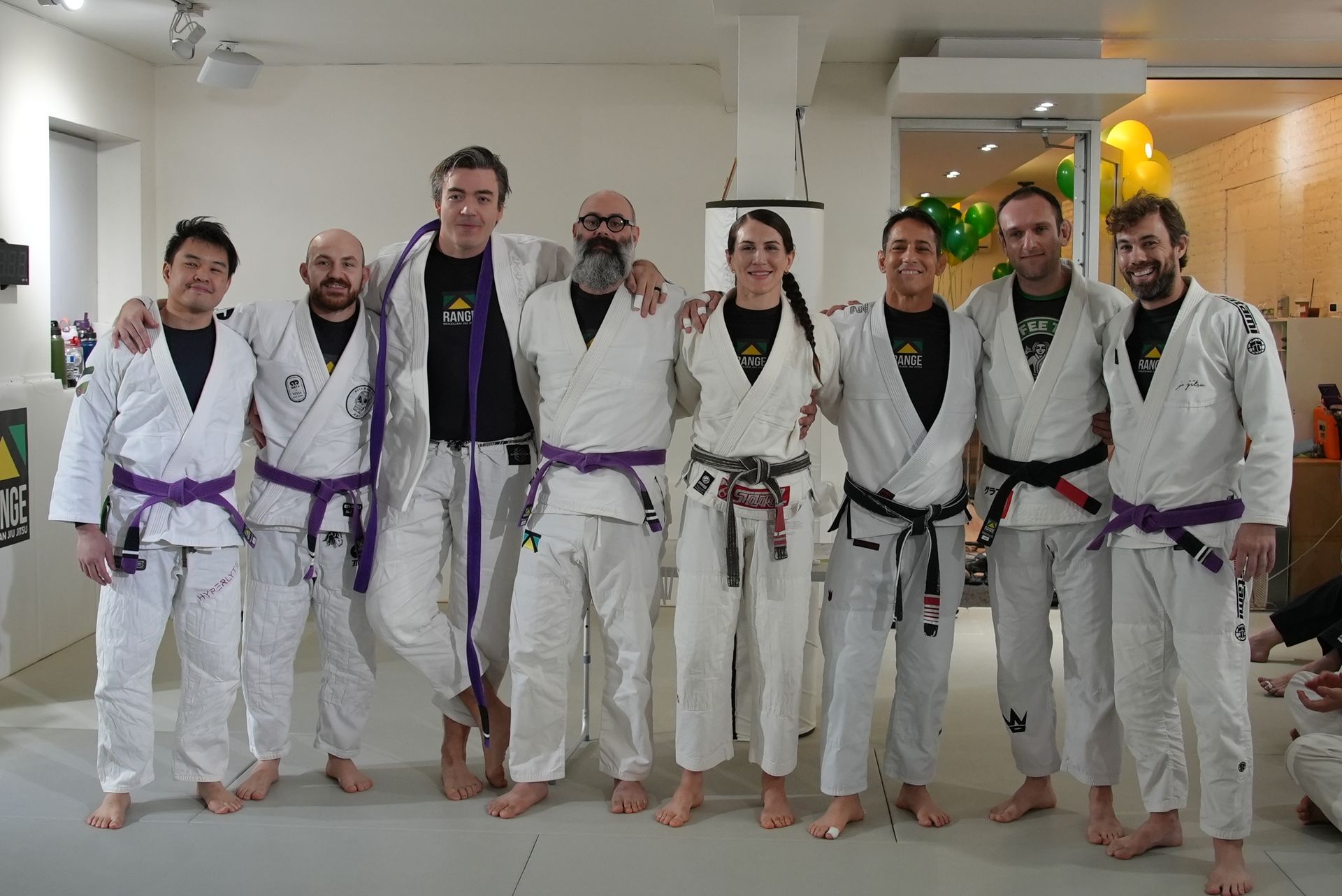 Adults drilling Brazilian Jiu-Jitsu techniques at Range Brazilian Jiu-Jitsu NYC in New York, NY for stress relief.